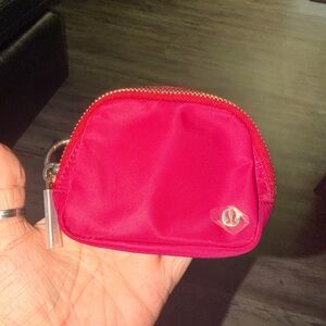 Lululemon Pink Pouch/money, lip stick. Card holder,Lanyard, and Inside pocket.